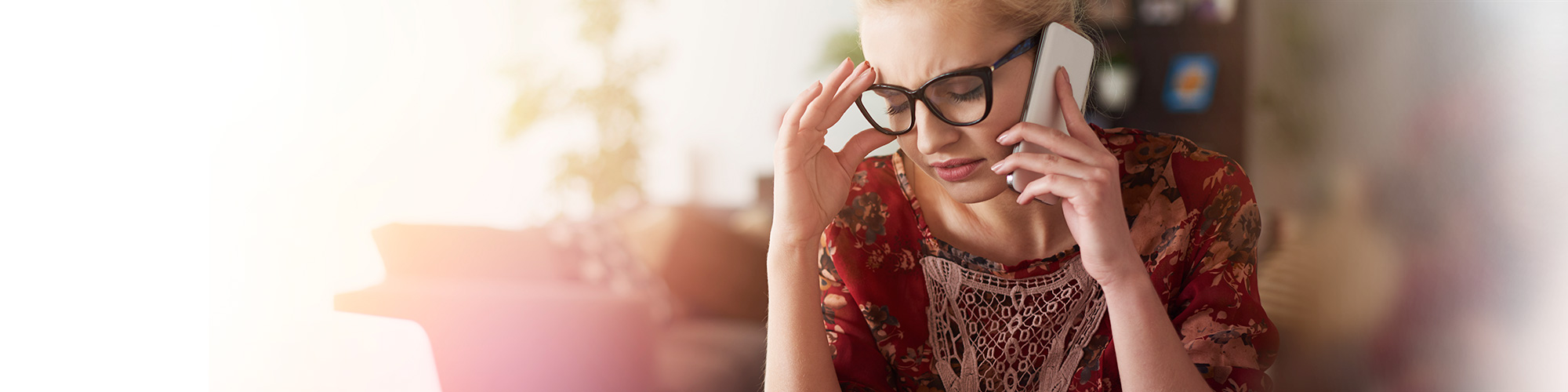 Woman on phone with eyes shut